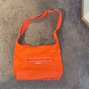 Super cute bright orange Longchamp bag!